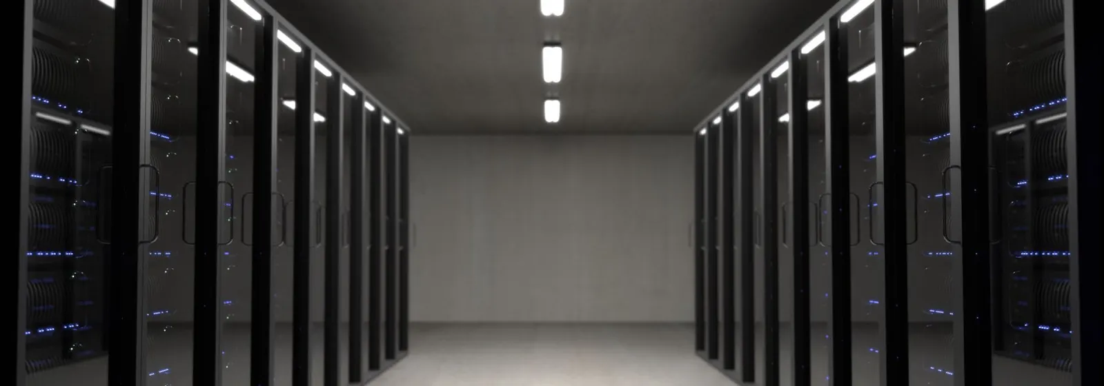 Cold aisle of a modern data hall with rows of server cabinets